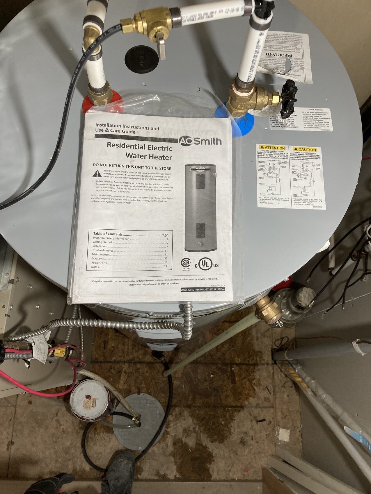 Hot water tank install with fittings and valves in Calgary